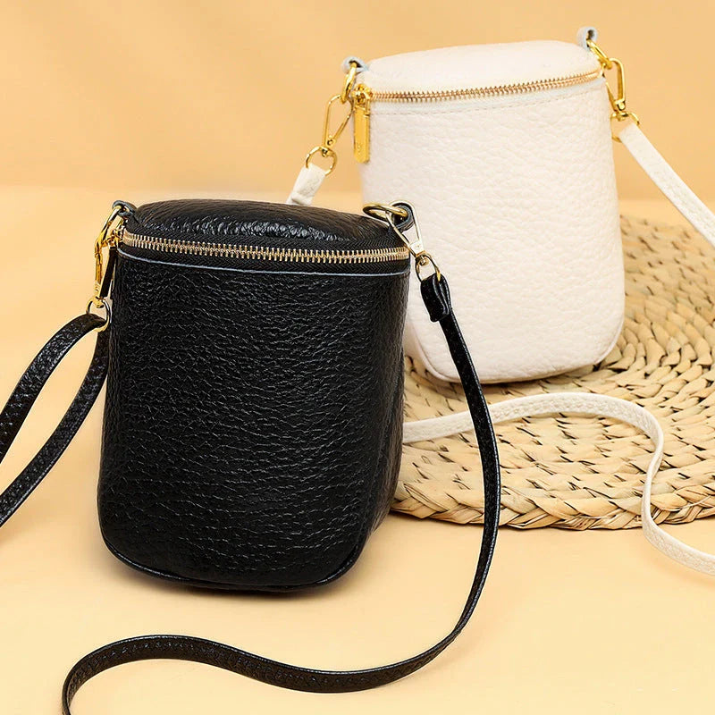 Premium leather crossbody bag with adjustable strap, multiple pockets, and sleek Korean-inspired style