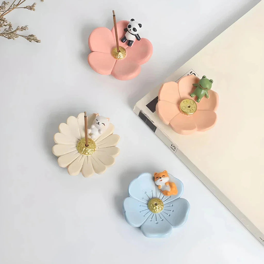 Elegant mini resin incense holder with cherry blossom, water lily, plum blossom, and daisy motifs for calming aromatherapy experience