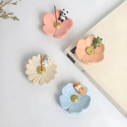 Elegant mini resin incense holder with cherry blossom, water lily, plum blossom, and daisy motifs for calming aromatherapy experience