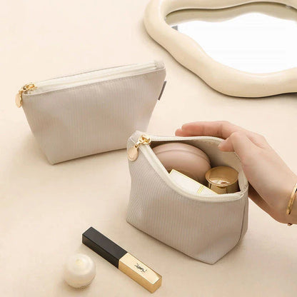 Mini portable waterproof cosmetic bag in beige and gray colors with a foldable design for convenient storage
