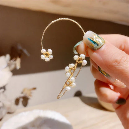 Elegant hand-woven freshwater pearl earrings with a unique geometric design, perfect for adding a touch of sophistication to any outfit.