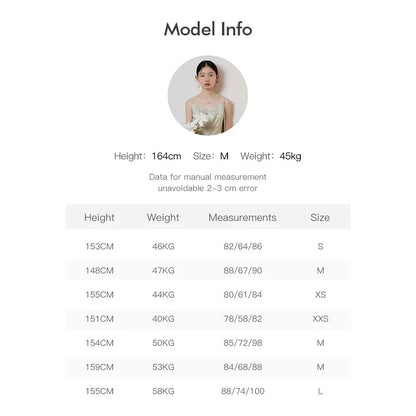 Elegant mint green midi dress with spaghetti straps, featuring a slim fit and intricate embroidery details