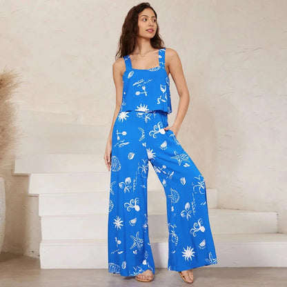 A stylish wide-leg jumpsuit with a paisley print design and a suspender top, perfect for women's casual and streetwear fashion.