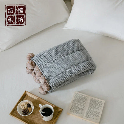 Cozy chenille ball-knit wool blanket in pink, gray, and white colors