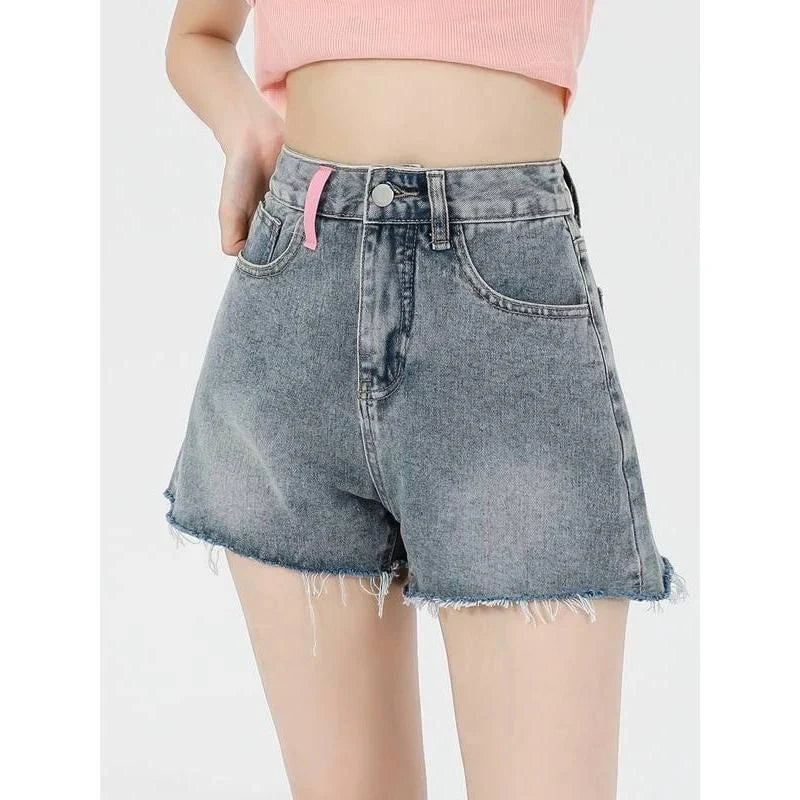 Premium high-waist denim shorts with charming embroidered details, perfect for summer fashion