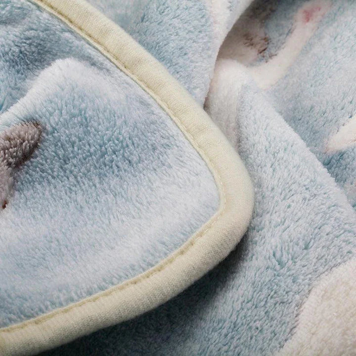 Cozy oversized fleece blanket in light blue and pink colors, suitable for both human and pet use