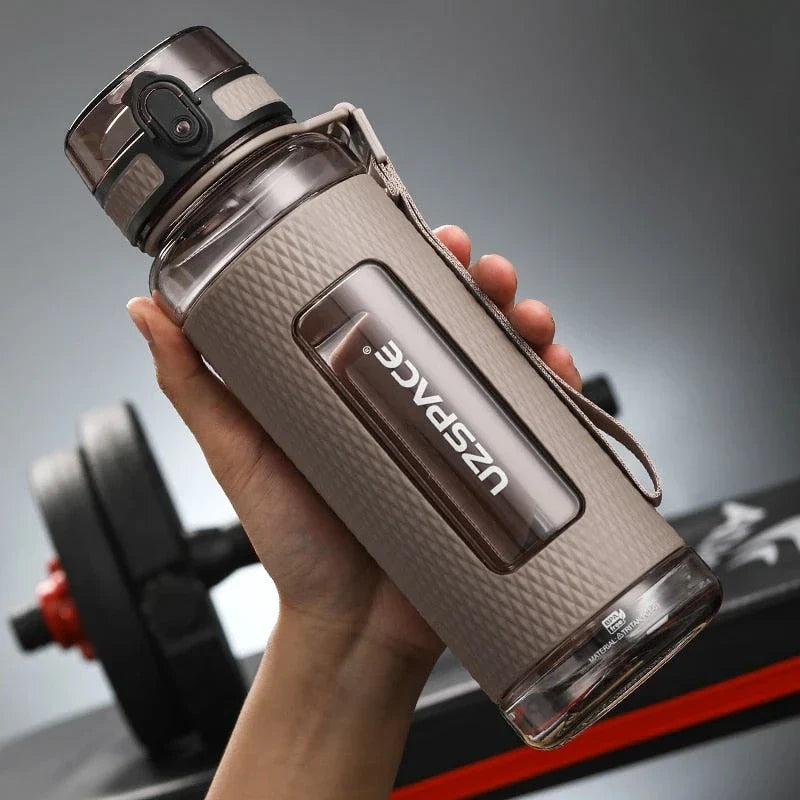 Portable sports water bottle with wide mouth, tea infuser, and leak-proof design for active lifestyles