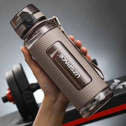 Portable sports water bottle with wide mouth, tea infuser, and leak-proof design for active lifestyles