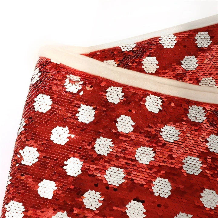 Festive Christmas tree skirt with red and white polka dot pattern and shimmering sequins