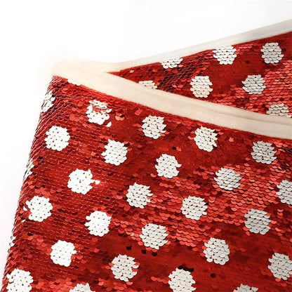 Festive Christmas tree skirt with red and white polka dot pattern and shimmering sequins