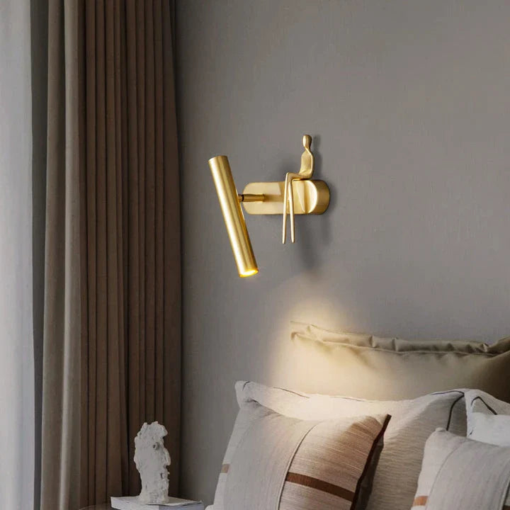 Stylish and versatile bedroom wall lamp with a sleek, postmodern design and a luxurious gold finish