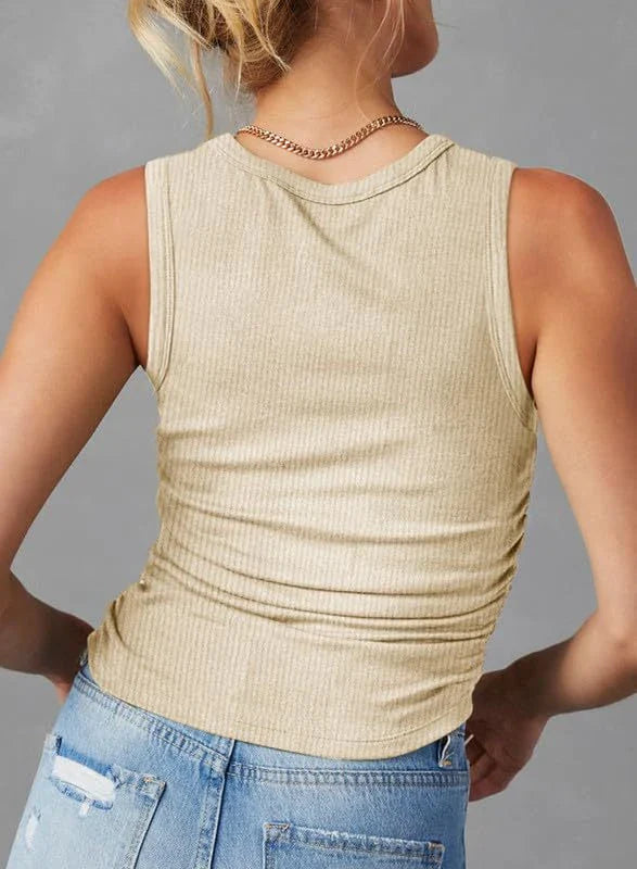 A sleeveless ribbed knit tank top for women in a variety of colors and sizes, featuring a crew neck design and pleated details for a stylish, casual look.