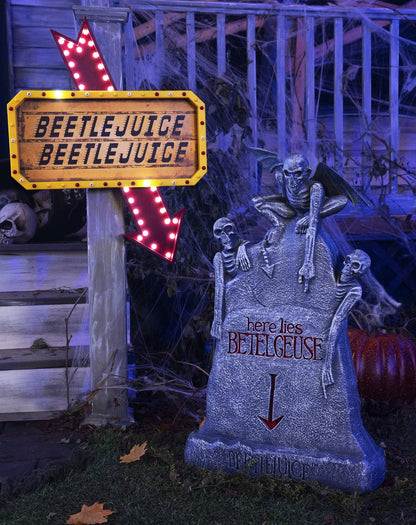 Glowing ghost skull tombstone decor with a spooky, otherworldly glow for Halloween