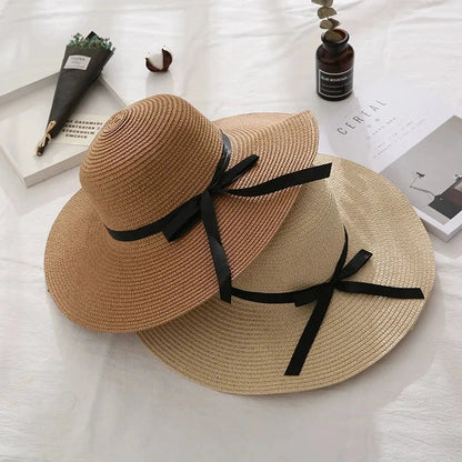 Fashionable summer straw hat for women with wide brim and bow detail, providing UV protection and stylish look