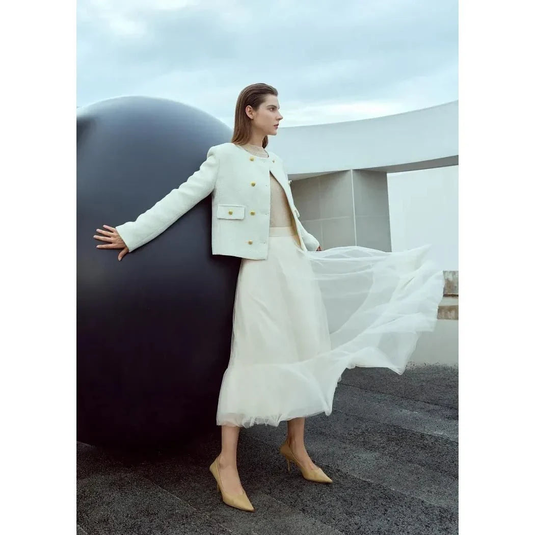 Elegant gauze A-line skirt in beige and white colors, featuring a graceful ankle-length design and unique patchwork detailing for a sophisticated look.