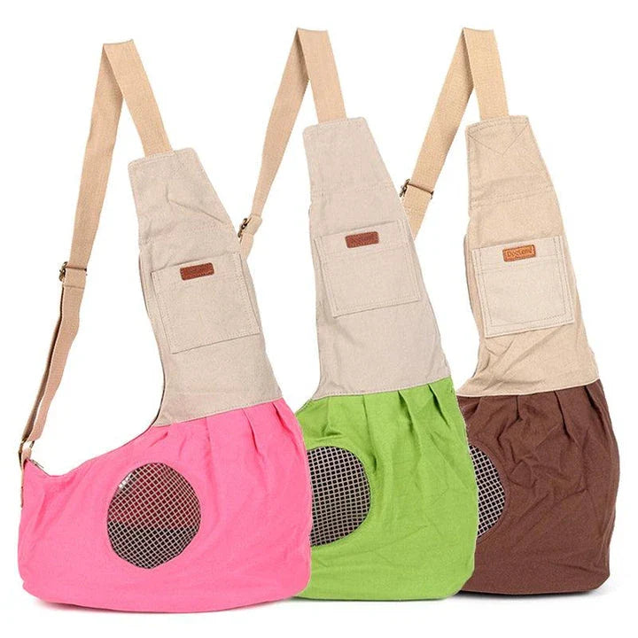Breathable canvas crossbody carrier for pets with adjustable strap and roomy interior