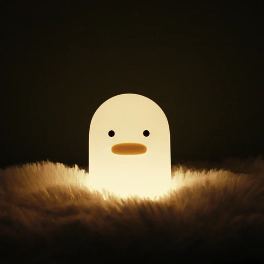Cute duck-shaped LED night light with silicone and ABS construction, USB charging, and adjustable brightness