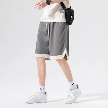 Men's loose and comfortable sports pirate shorts in white, gray, and black colors with elasticized waistband and relaxed fit