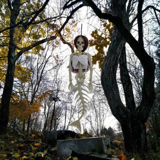 Mermaid bone pendant in various colors, including brown, dark purple, burgundy, and lake blue, hanging outdoors for Halloween decoration