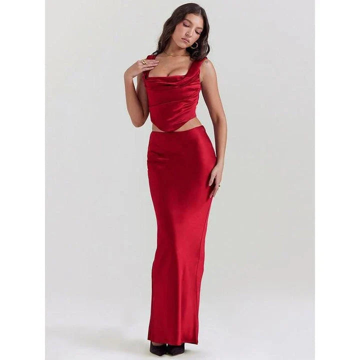 Elegant satin two-piece formal skirt set with backless crop top and ankle-length skirt in a sophisticated wine color