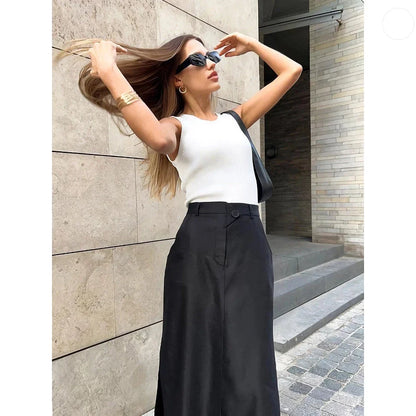 Elegant black ankle-length a-line skirt with pockets, made from a premium blend of polyester, spandex, and viscose for a comfortable, non-stretch fit.