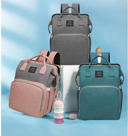 Multifunctional maternity diaper backpack with detachable crib, large capacity, and water-resistant design for travel