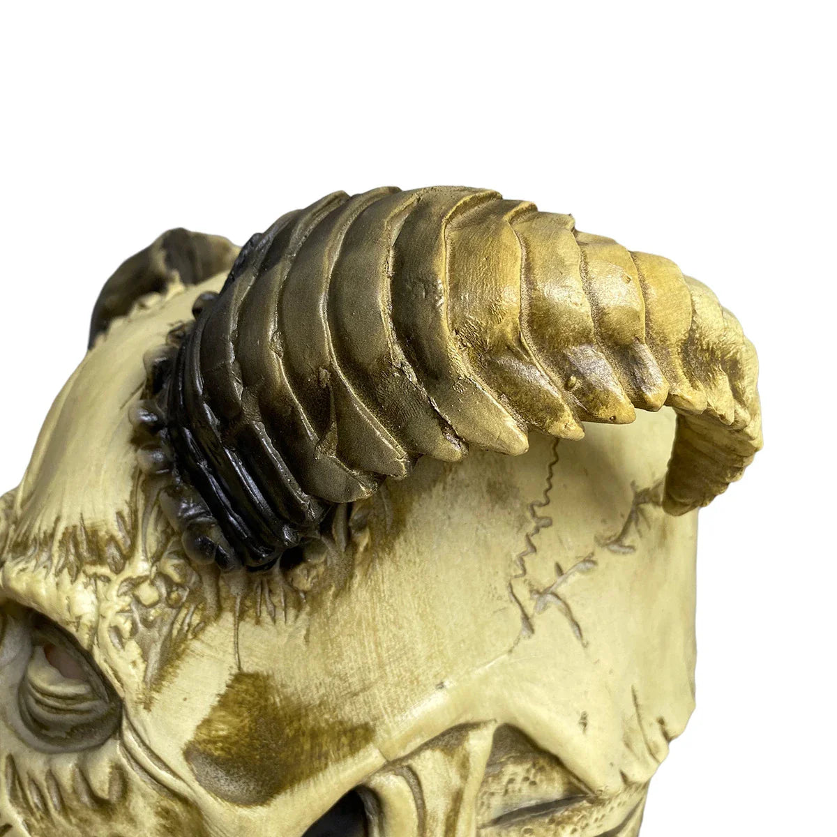 A terrifying Halloween mask made of latex, featuring a skull design with horns to create a dark, demonic appearance.