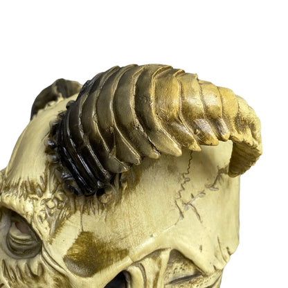 A terrifying Halloween mask made of latex, featuring a skull design with horns to create a dark, demonic appearance.