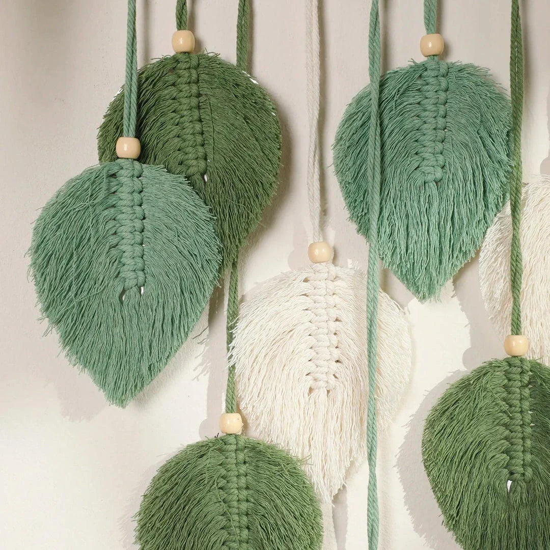 Boho macrame leaf tapestry in earthy tones, featuring elegant leaves and flowing tassels for a cozy, nature-inspired decor piece