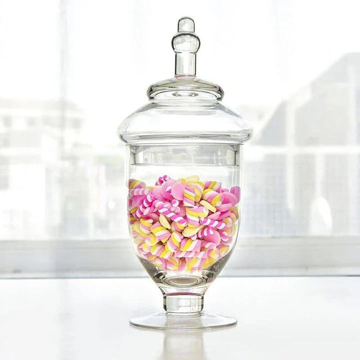 A transparent glass candy jar with an airtight lid, suitable for weddings, parties, and home decor