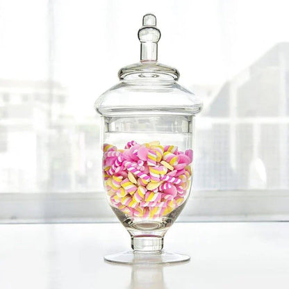 A transparent glass candy jar with an airtight lid, suitable for weddings, parties, and home decor