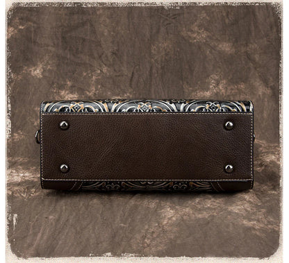 A fashionable large capacity leather shoulder bag for women in a vintage-inspired floral design with multiple interior pockets for organization.