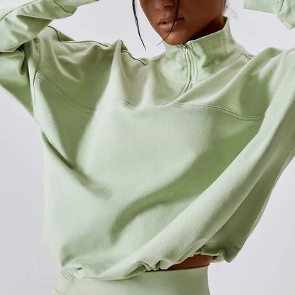 Cozy cotton pullover with zipper detail, available in purple, black, and gray colors