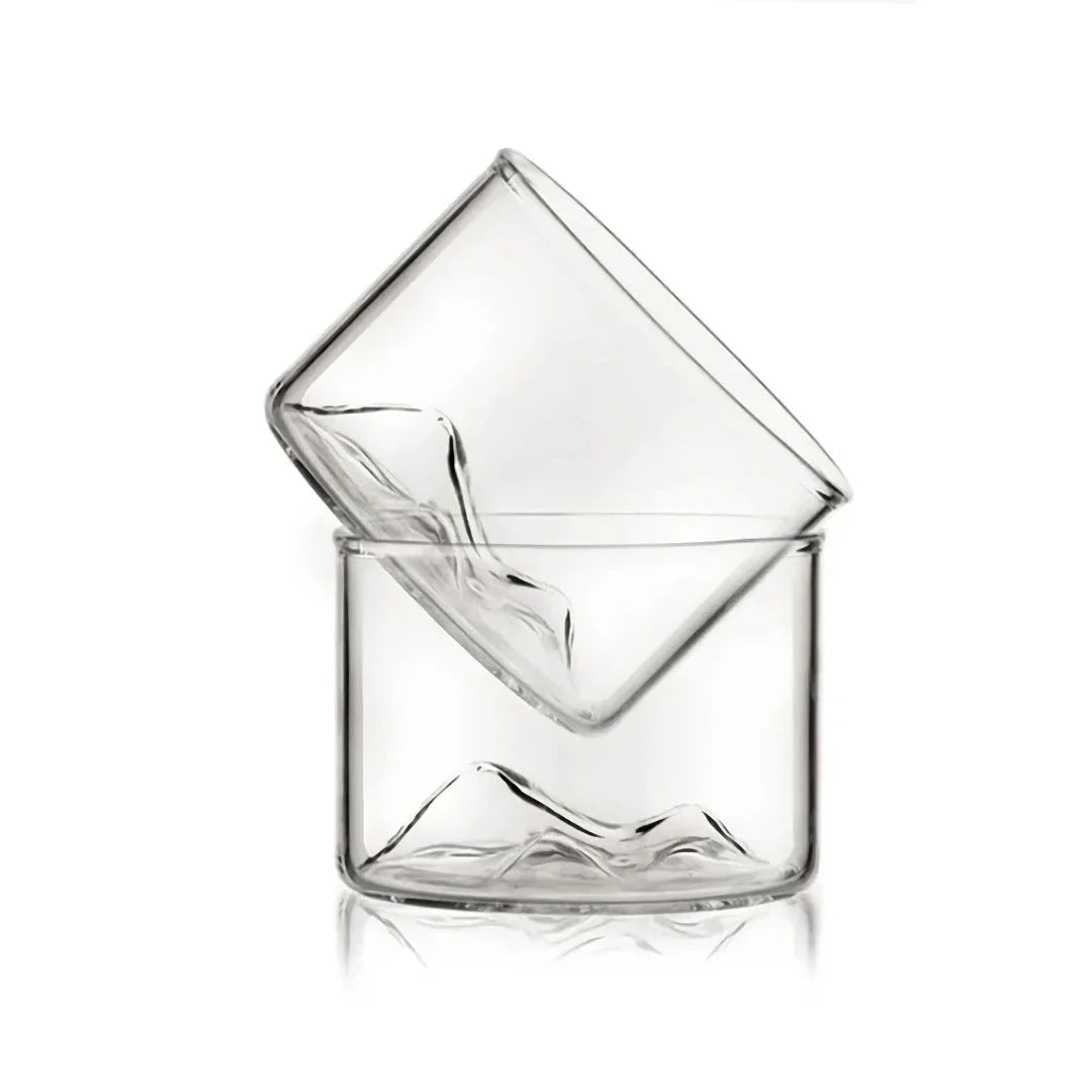 Elegant mountain-inspired whiskey glass with a wooden base, perfect for enjoying a variety of hot and cold beverages
