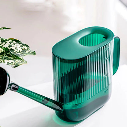 A large, dark grey gardening watering can with a long spout and sprinkler head for efficient, hassle-free plant watering