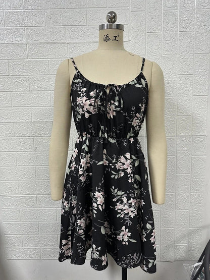 A stylish floral print suspender dress with an elastic waist, perfect for summer fashion and casual or dressy occasions.