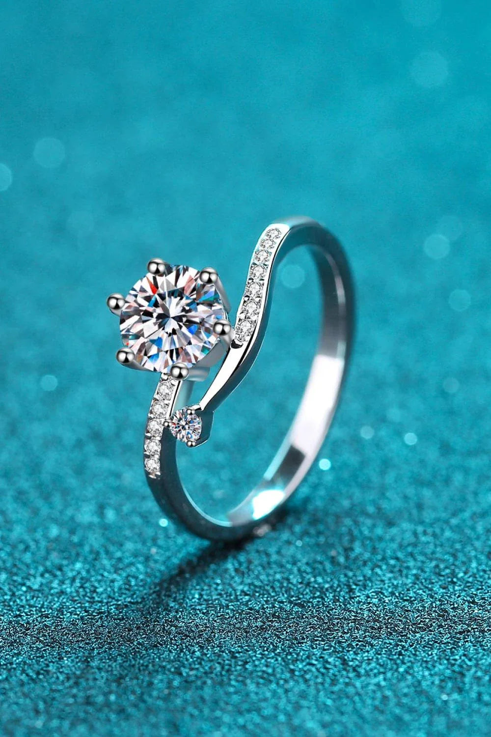 Elegant 925 sterling silver moissanite ring with a dazzling center stone and rhodium-plated finish