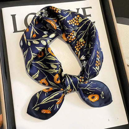 Floral print silk scarf in navy color, a versatile accessory for effortless style