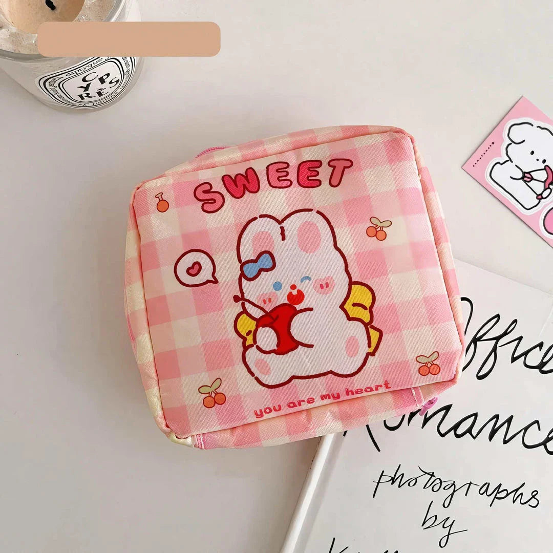 Adorable cartoon nylon cosmetic bag with secure zipper closure and compact, box-shaped design