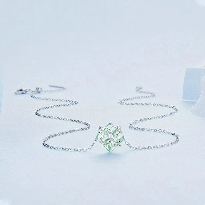 Elegant platinum-plated adjustable green pendant necklace with a sleek, silver-toned chain and a stylish green pendant