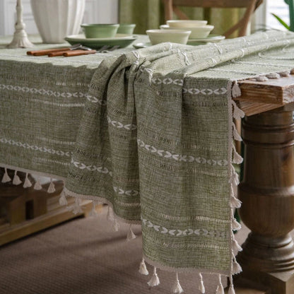 Elegant hollowed-out green tablecloth with a sophisticated and rustic design, perfect for American-style dining and events
