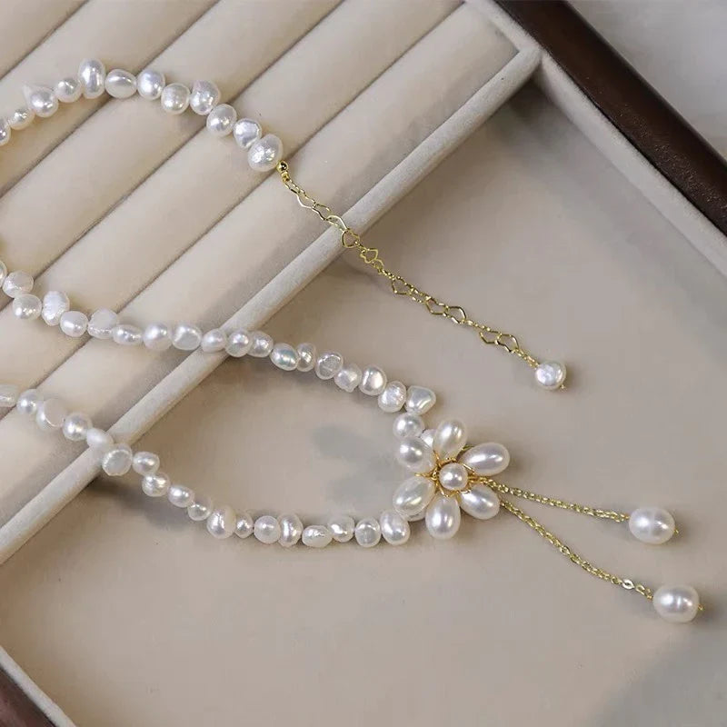 Elegant 14K gold-plated necklace with natural freshwater pearls in a unique cross-chain design