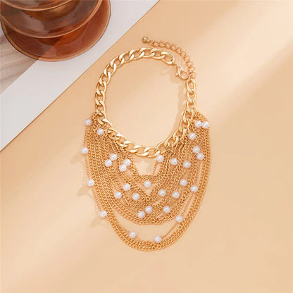 Elegant Boho Chic Tassel Pearl Anklet for Women in Gold, a glamorous accessory that enhances any outfit