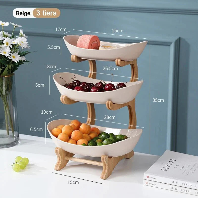 Three-tier plastic and bamboo fruit display tray with unique leaf-shaped design, available in white, beige, and green colors