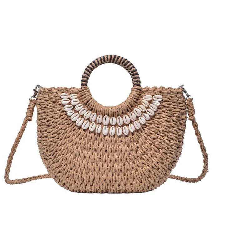Handmade straw woven crossbody handbag with seashell accents, perfect for summer beach and resort wear