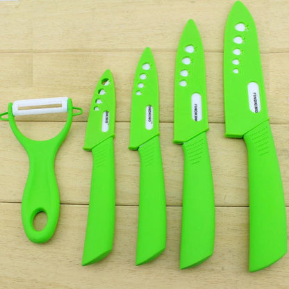 Vibrant ceramic knives in various colors, including red, blue, green, black, yellow, and orange, arranged on a white background.