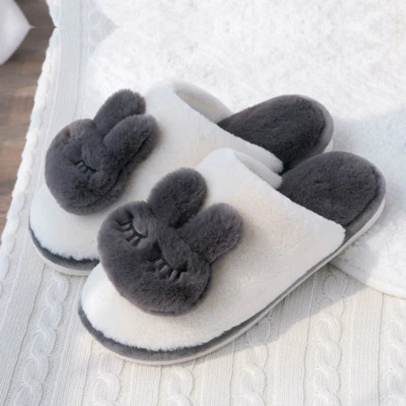 Cozy cotton slippers in a soft pink color, featuring a plush, non-slip design for comfortable home wear