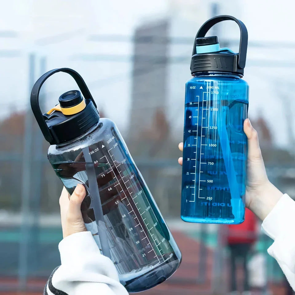 A large capacity sports water bottle with a straw lid and time stamps, designed for ultimate hydration and convenience.