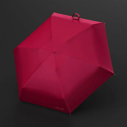 Chic and compact portable sun and rain umbrella in various colors, ideal for travel and outdoor events
