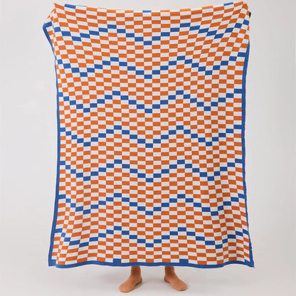 Cozy and stylish plaid blanket in blue, perfect for home decor, travel, and outdoor activities